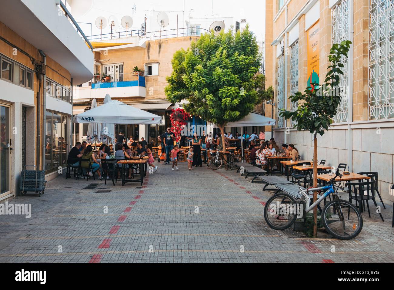 restaurant patrons dine outdoors in the old city of Nicosia, Cyprus Stock Photo