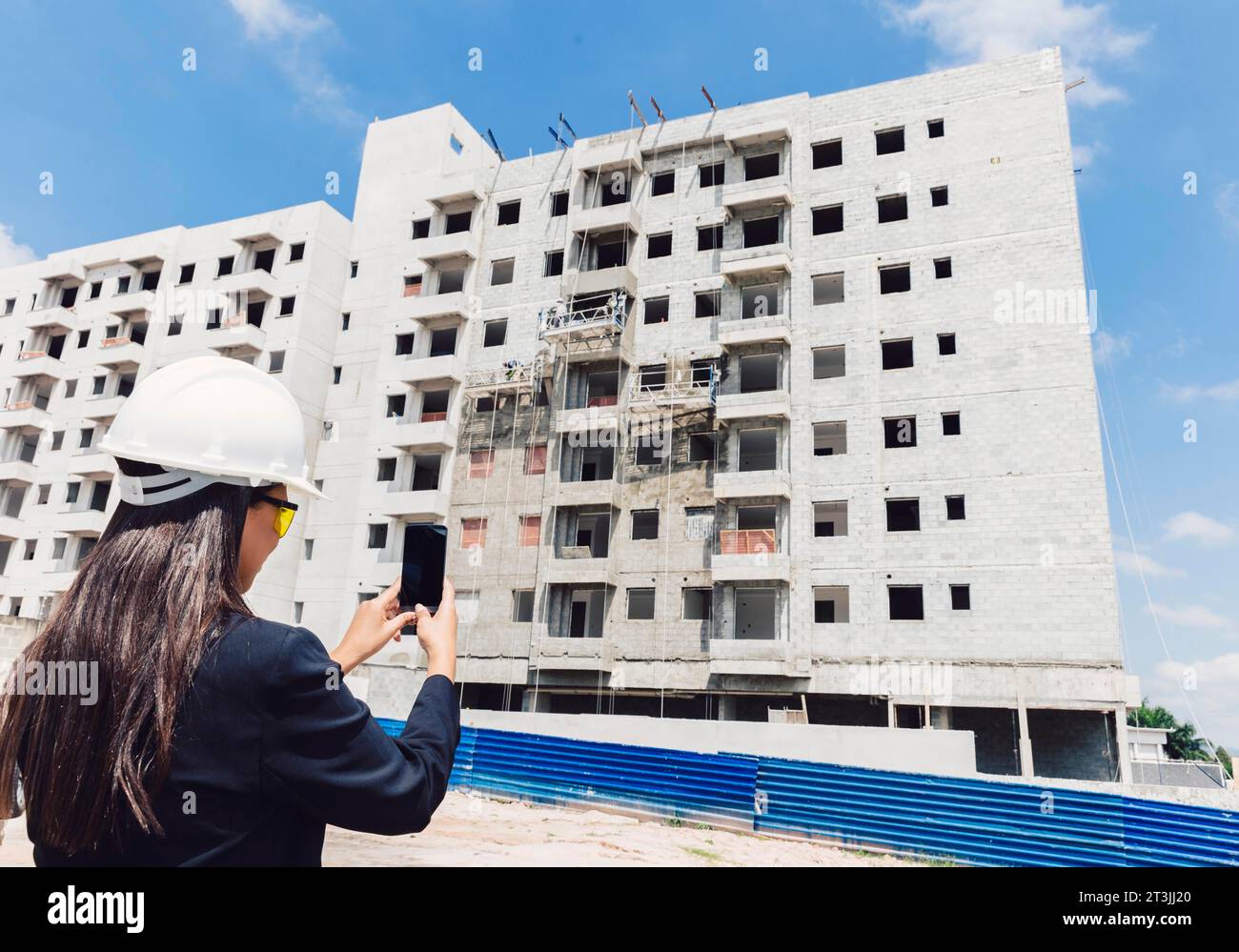 African american lady safety helmet taking building construction Stock Photo