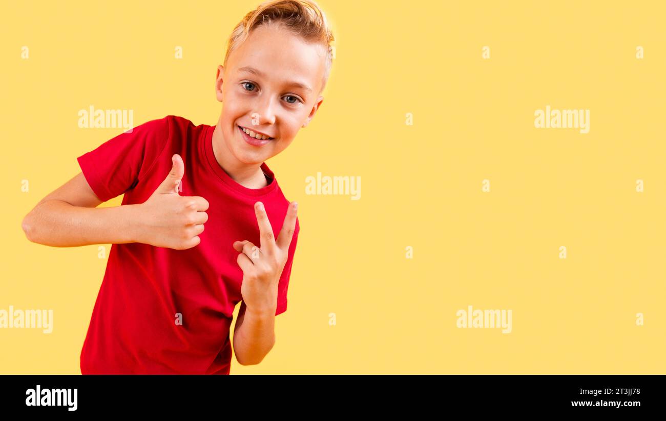 Boy showing ok sign peace with copy space Stock Photo