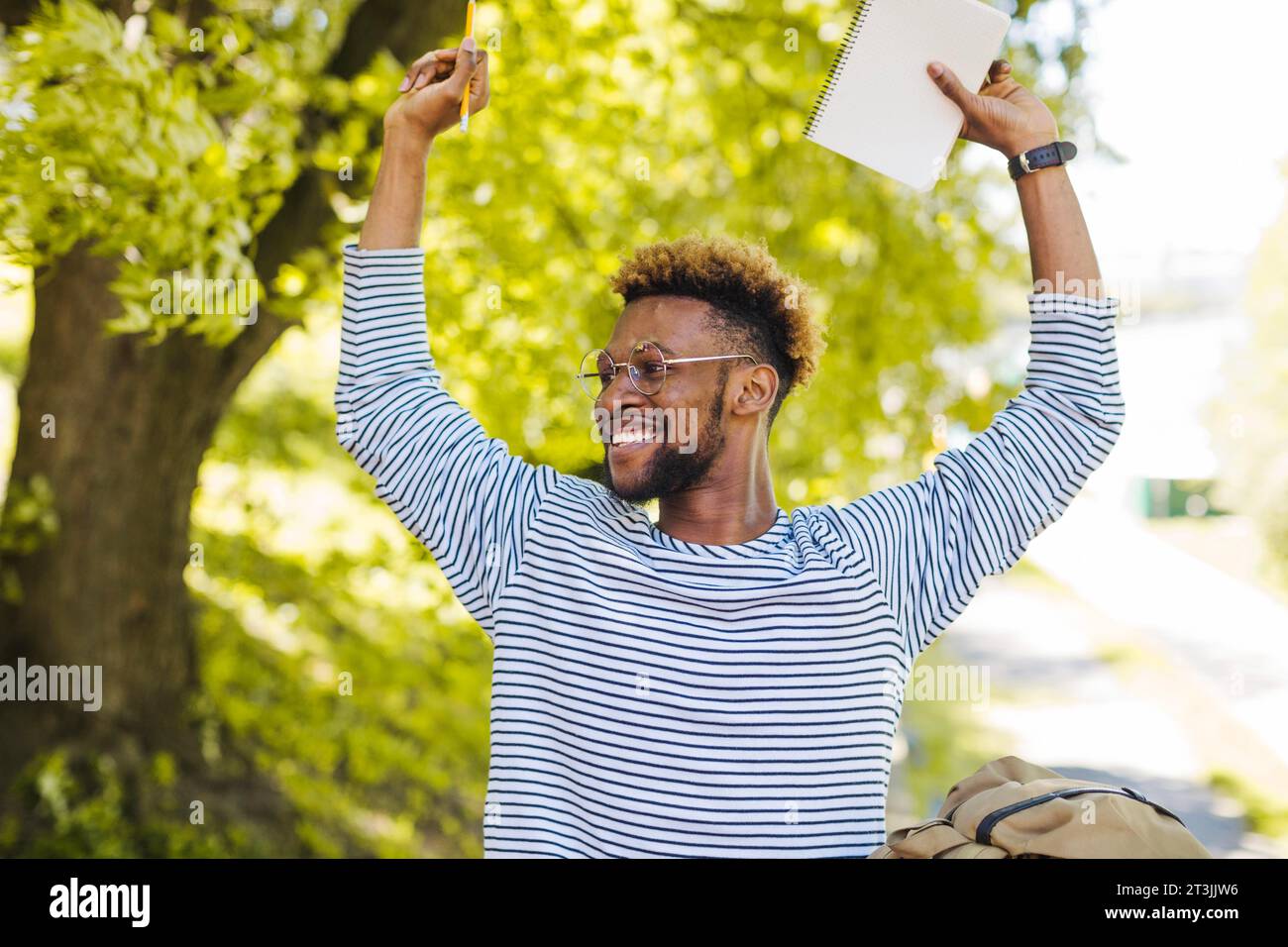 Excited black man posing with hand sup Stock Photo