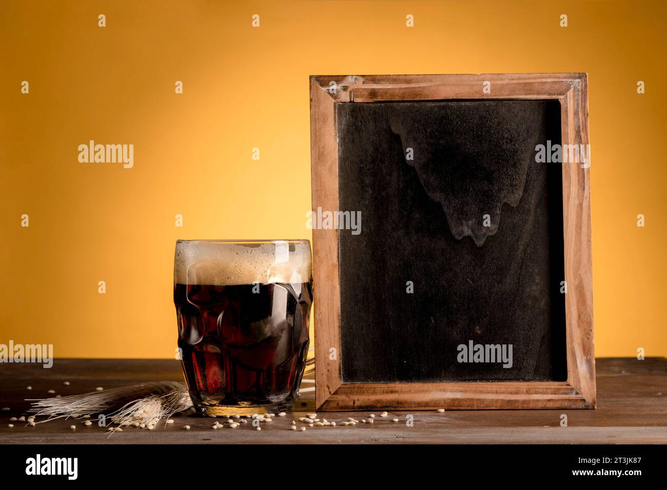 Glass beer putting blackboard wooden table Stock Photo