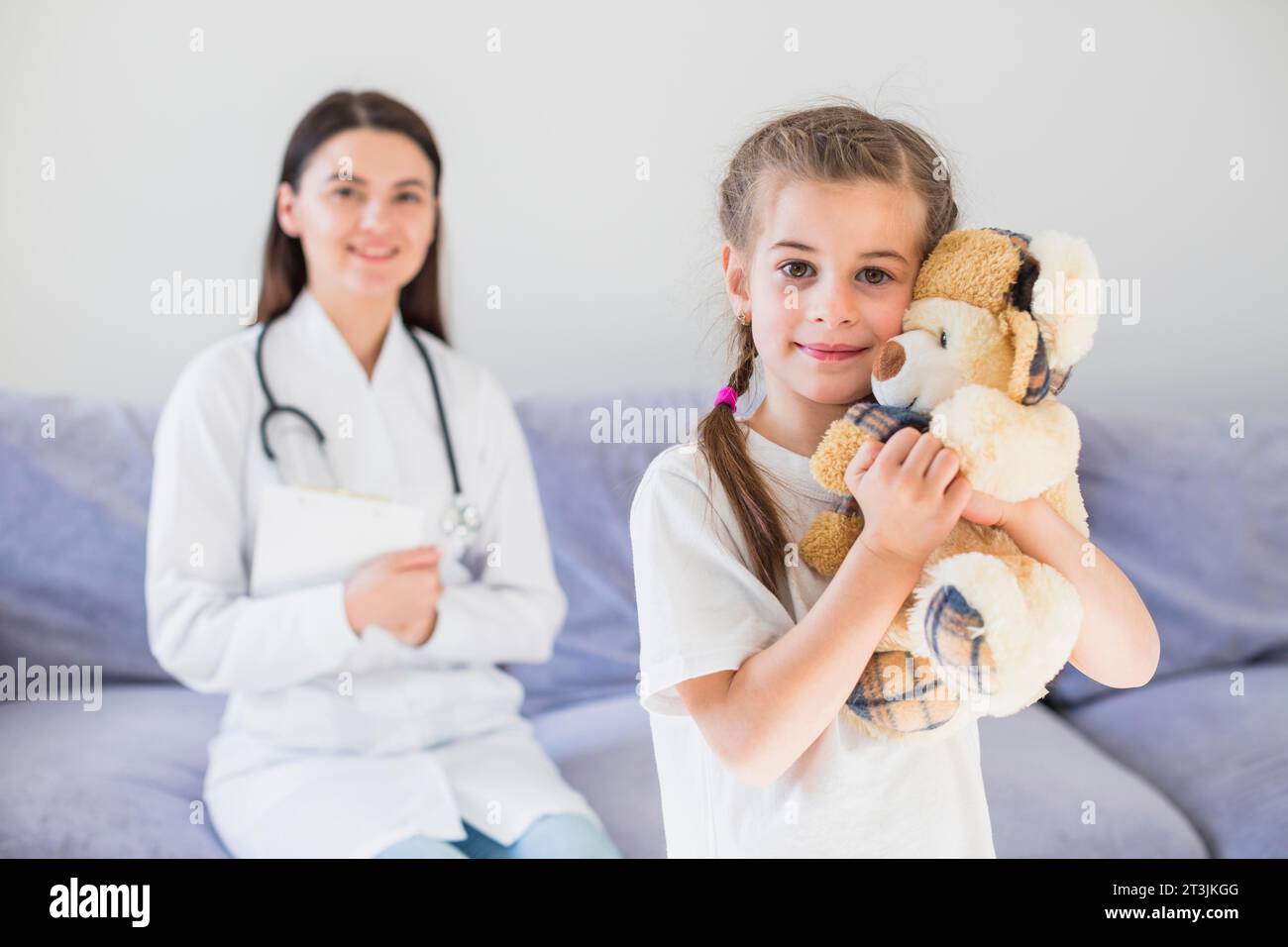Ill girl being examined by doctor Stock Photo
