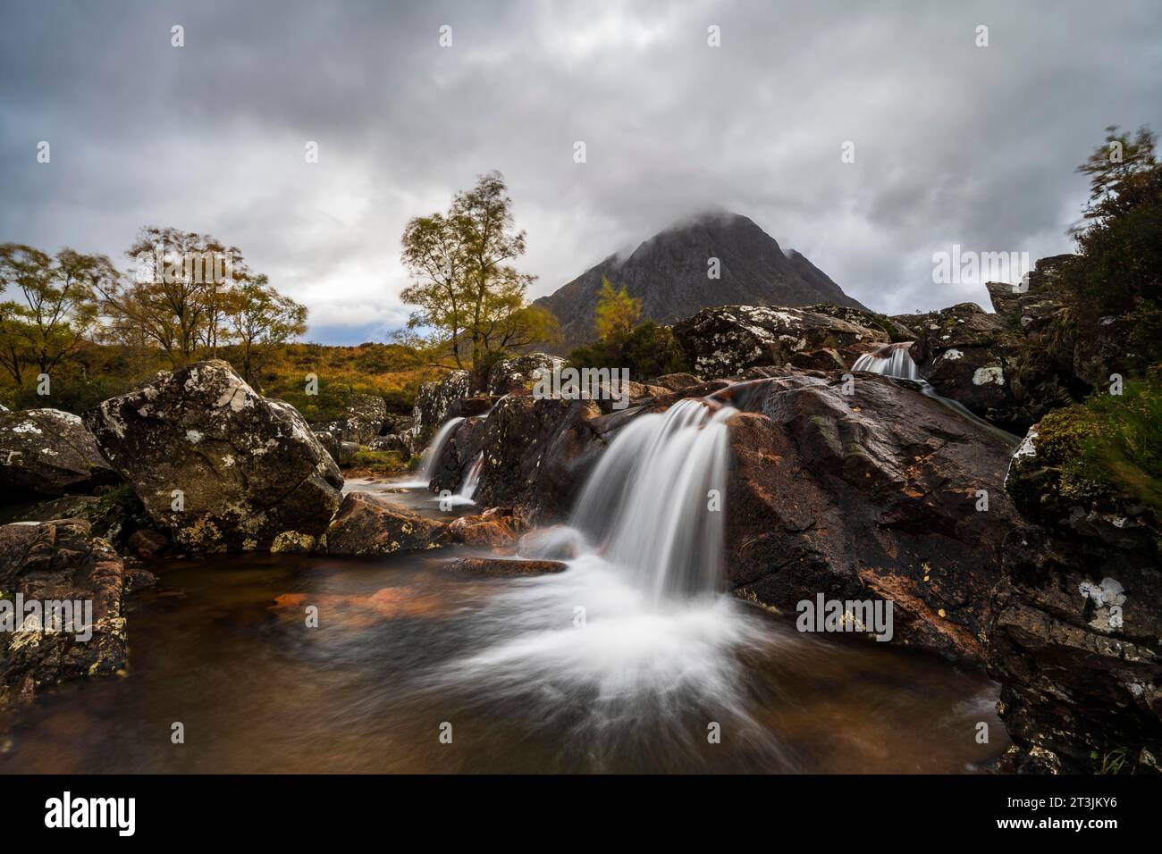 Waterfall in Autumn Landscape, Buachaille Etive Mor Mountain in Glen Etive, Glencoe Valley, West Highlands, Scotland, United Kingdom Stock Photo