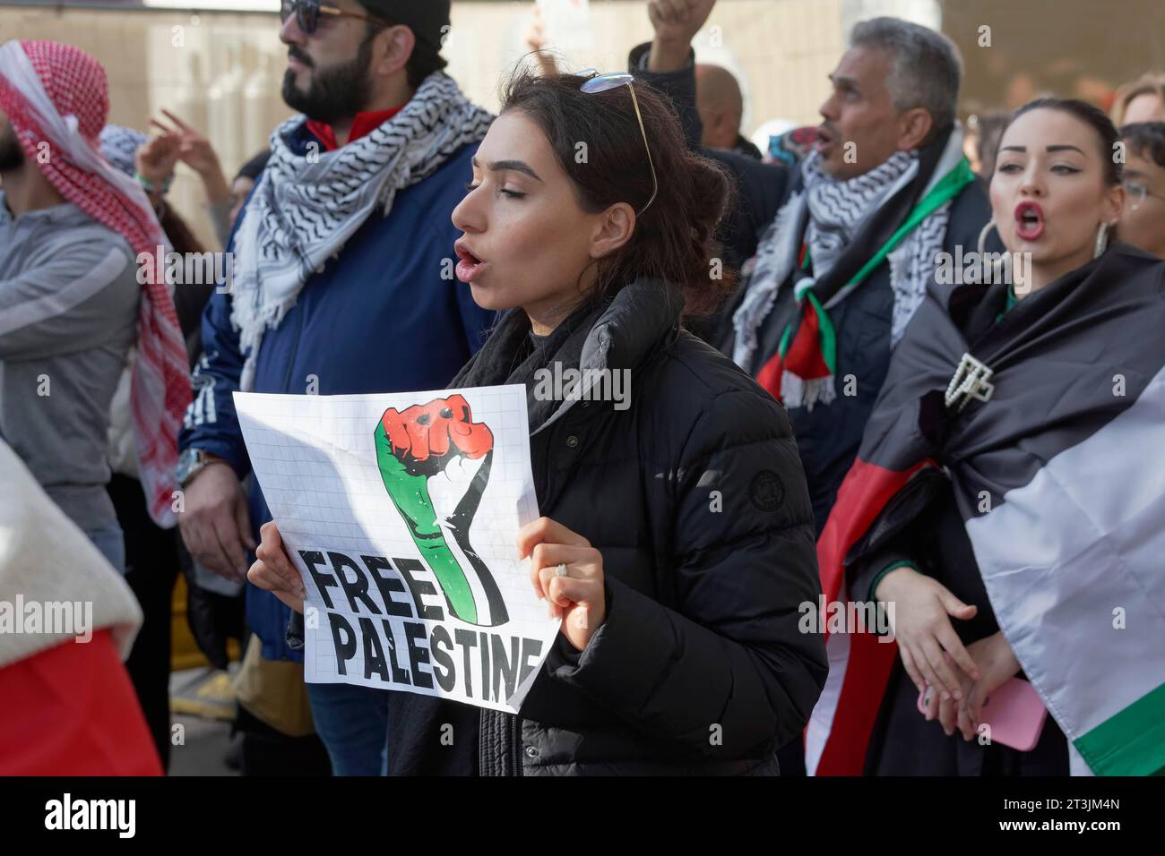 Woman holding sign Free Palestine, Freedom for Palestine, pro-Palestinian rally condemning war crimes against civilians in Gaza on 21.10.2023 in Stock Photo