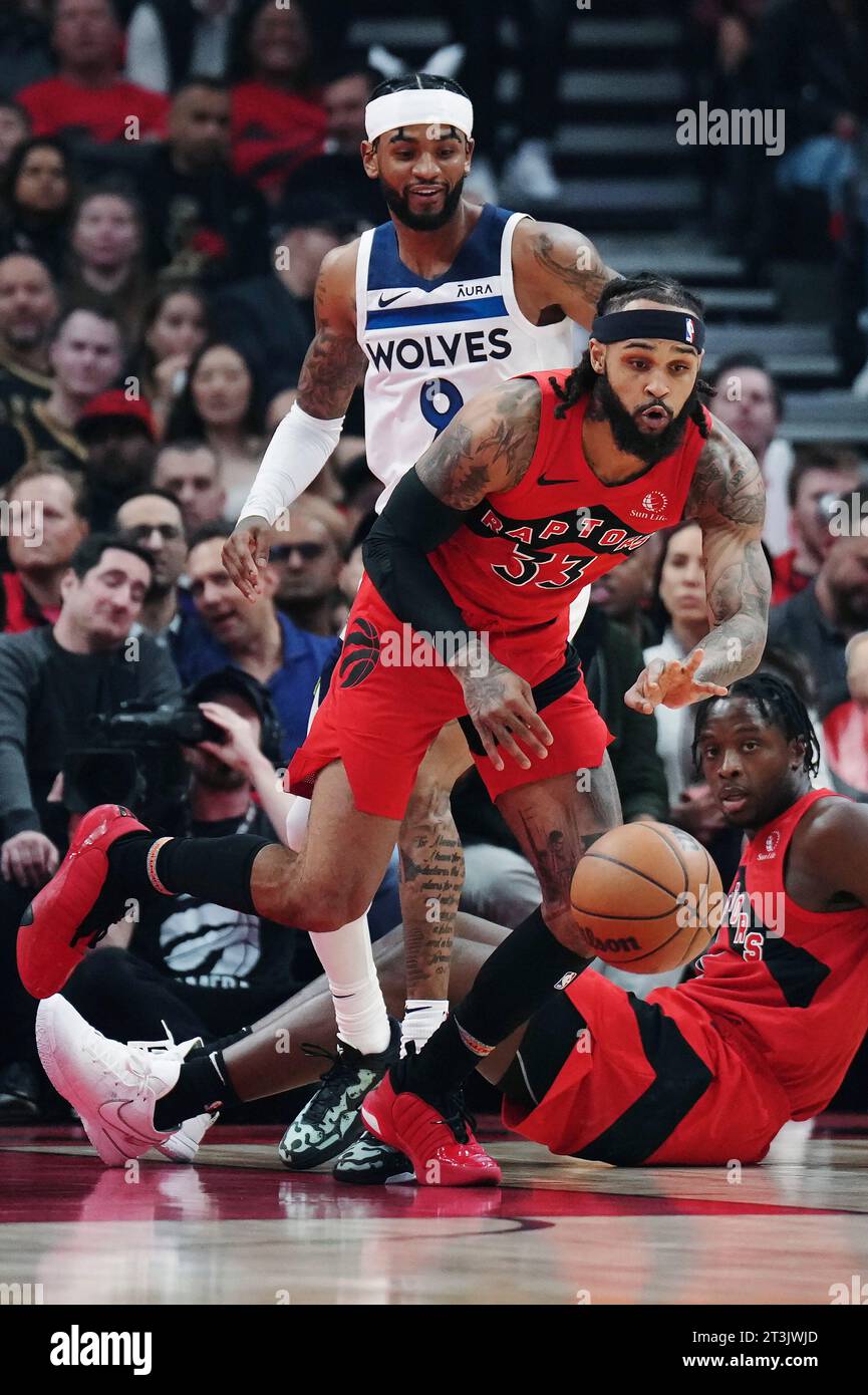 Toronto Raptors' Gary Trent Jr. (33) reaches for the ball as Minnesota