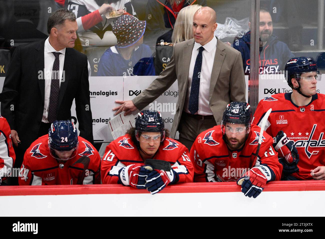 Washington Capitals head coach Spencer Carbery, right, looks on during ...