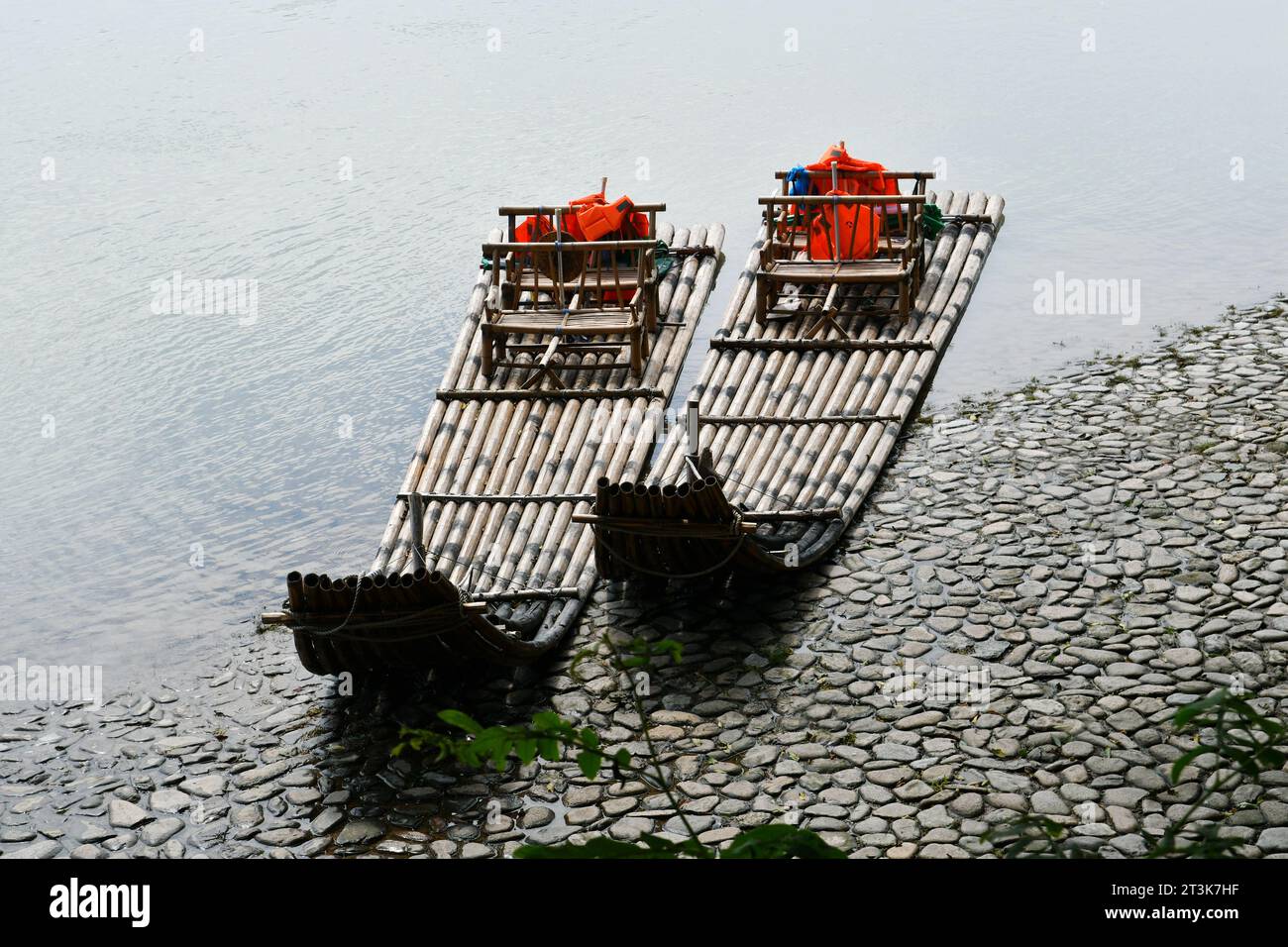 Photo of two traditional Chinese style bamboo rafts moored on the shore Stock Photo
