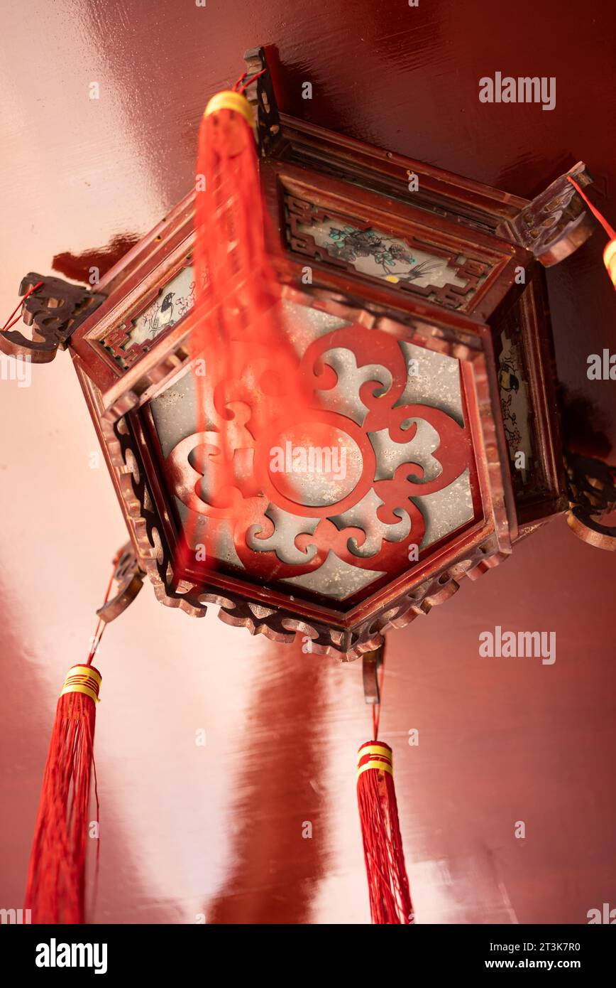Buddhist lamps hanging high in temples Stock Photo
