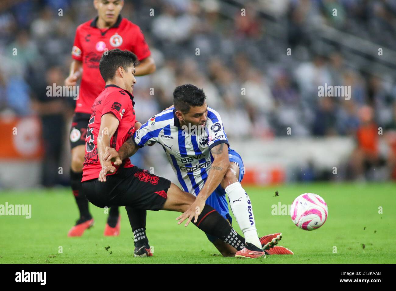 Monterrey, Mexico. 25th Oct, 2023. October 25th 2023, Estádio BBVA, Monterrey, Mexico: Liga BBVA MX postponed 4th round match between Monterrey Rayados and Club Tijuana Xolos. #12 Midfielder Rayados, Jesús Tecatito Corona stopped by #15 Defender Club Tijuana, Diego Barbosa Mandatory Credit: Toby Tande/PXImages Credit: Px Images/Alamy Live News Stock Photo