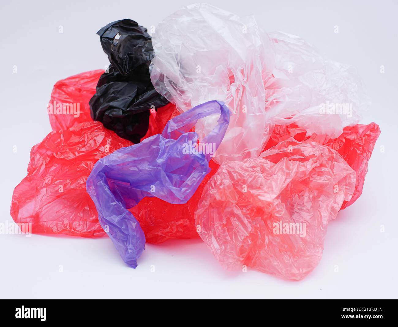 skein of purple plastic trash bags with strings isolated on white  background, close up Stock Photo - Alamy