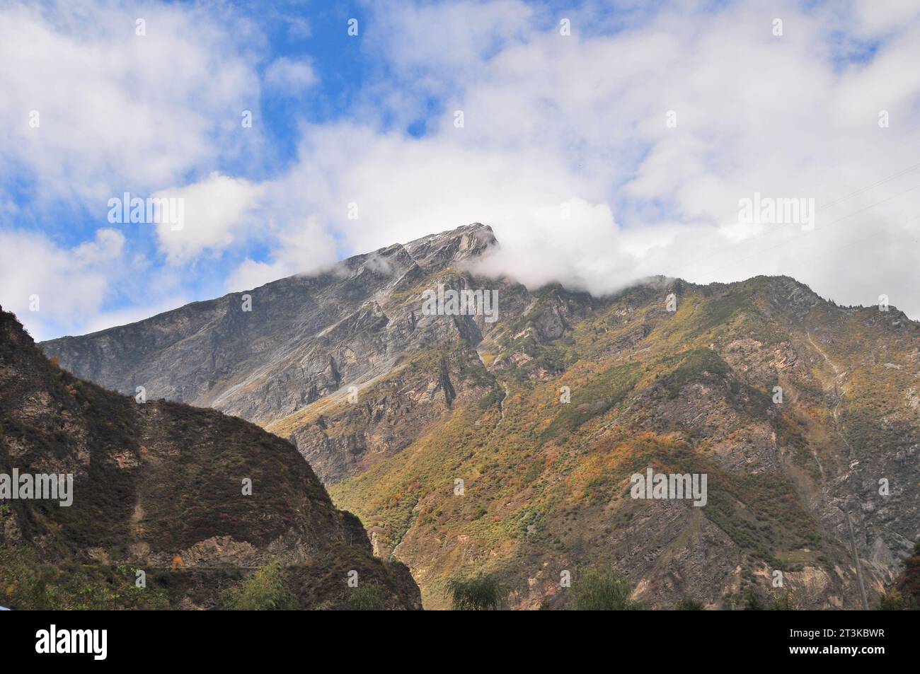 Photo of mountains shrouded in clouds and fog Stock Photo - Alamy