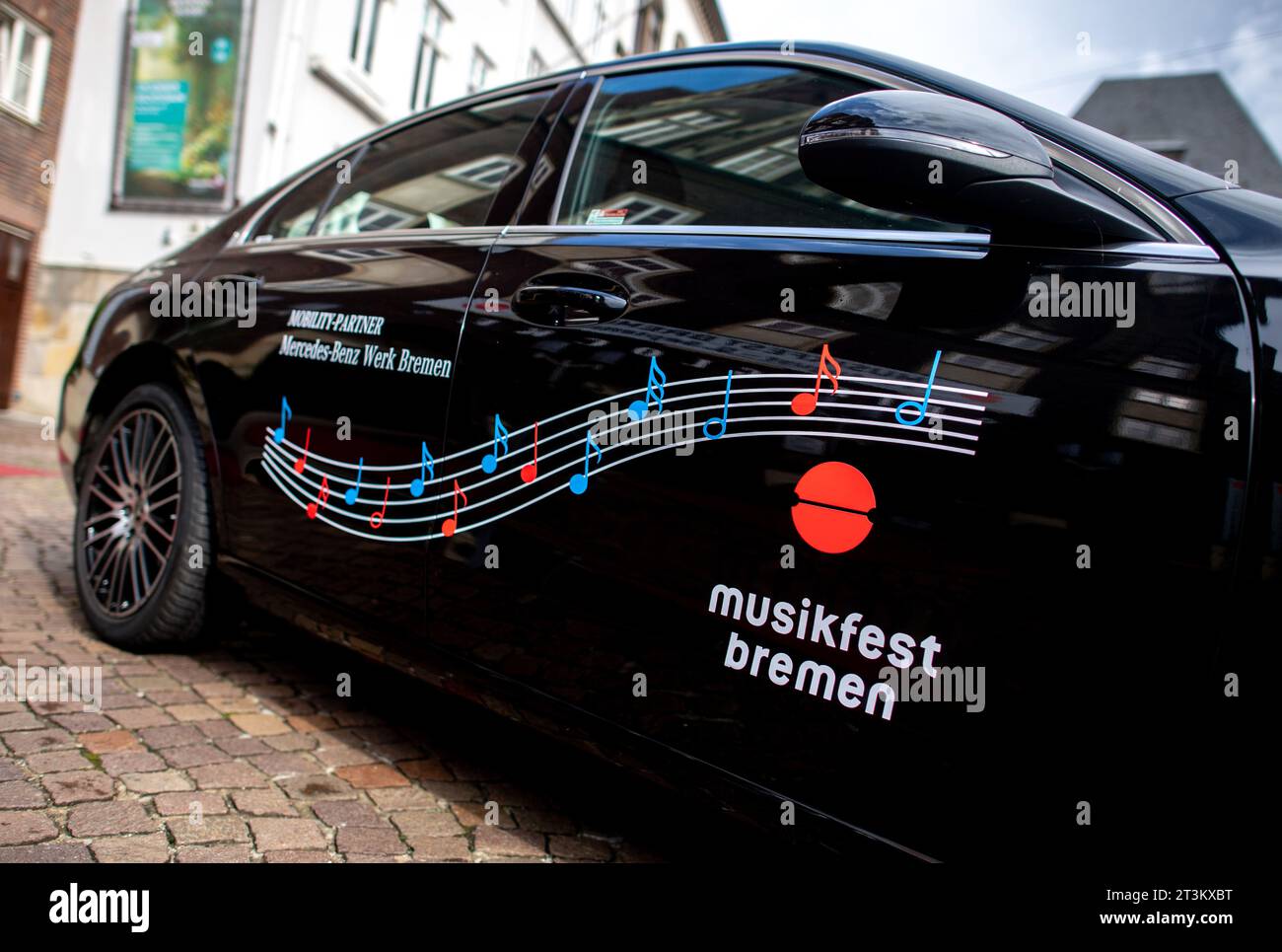 Bremen, Germany. 31st Aug, 2023. A vehicle with the inscription 'Musikfest Bremen' and the logo of the event is parked in front of the concert hall Glocke in the city center. Credit: Hauke-Christian Dittrich/dpa/Alamy Live News Stock Photo