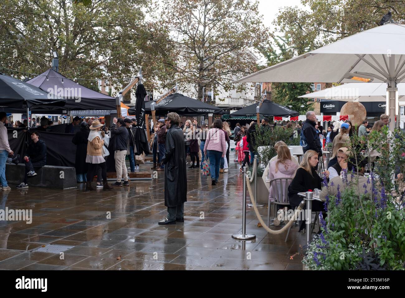 A busy Duke of York Square, Kings Road, London, food market despite the rainy day Stock Photo