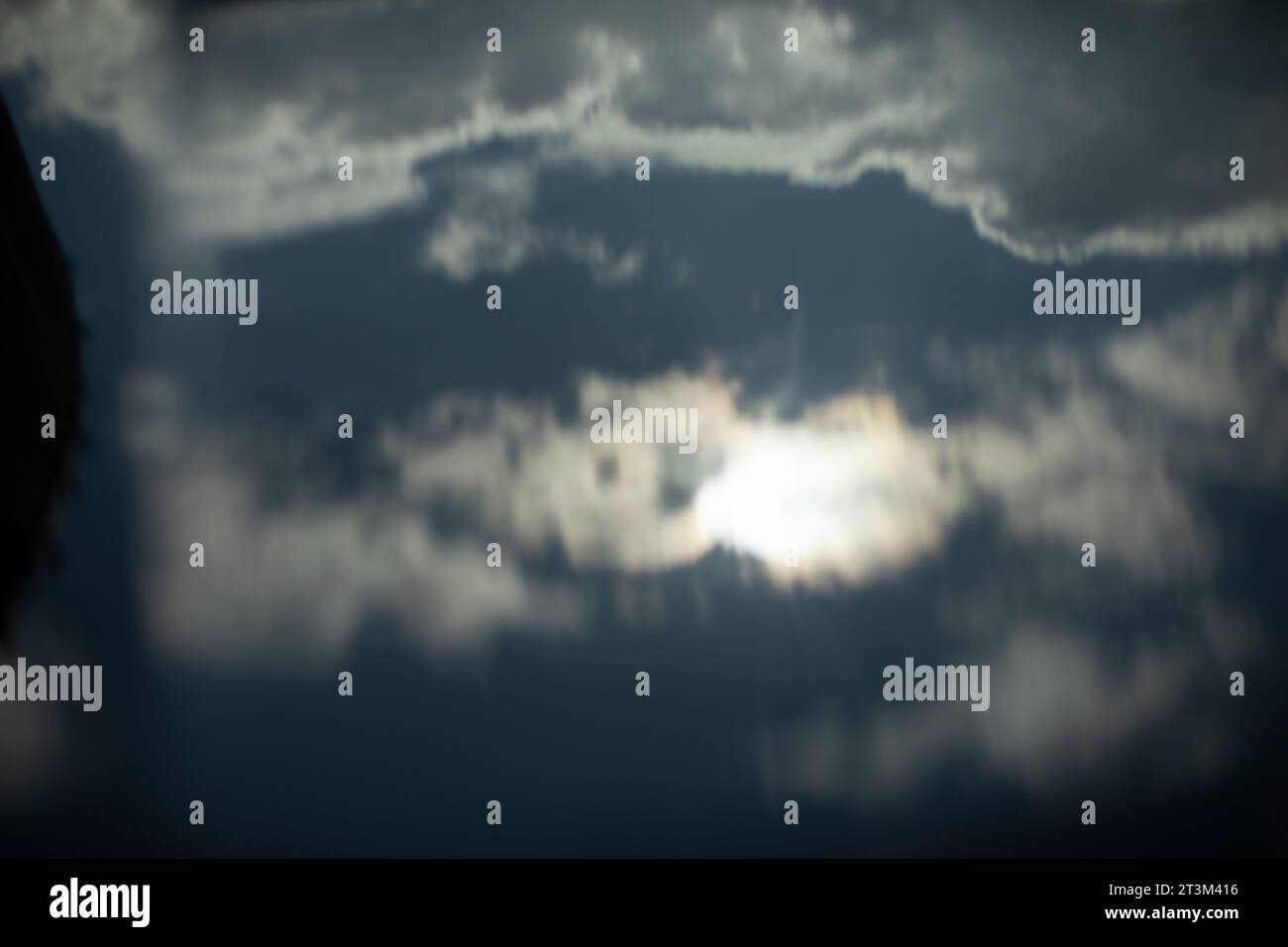 Reflection of sky in surface. Distorted reality in reflection ...