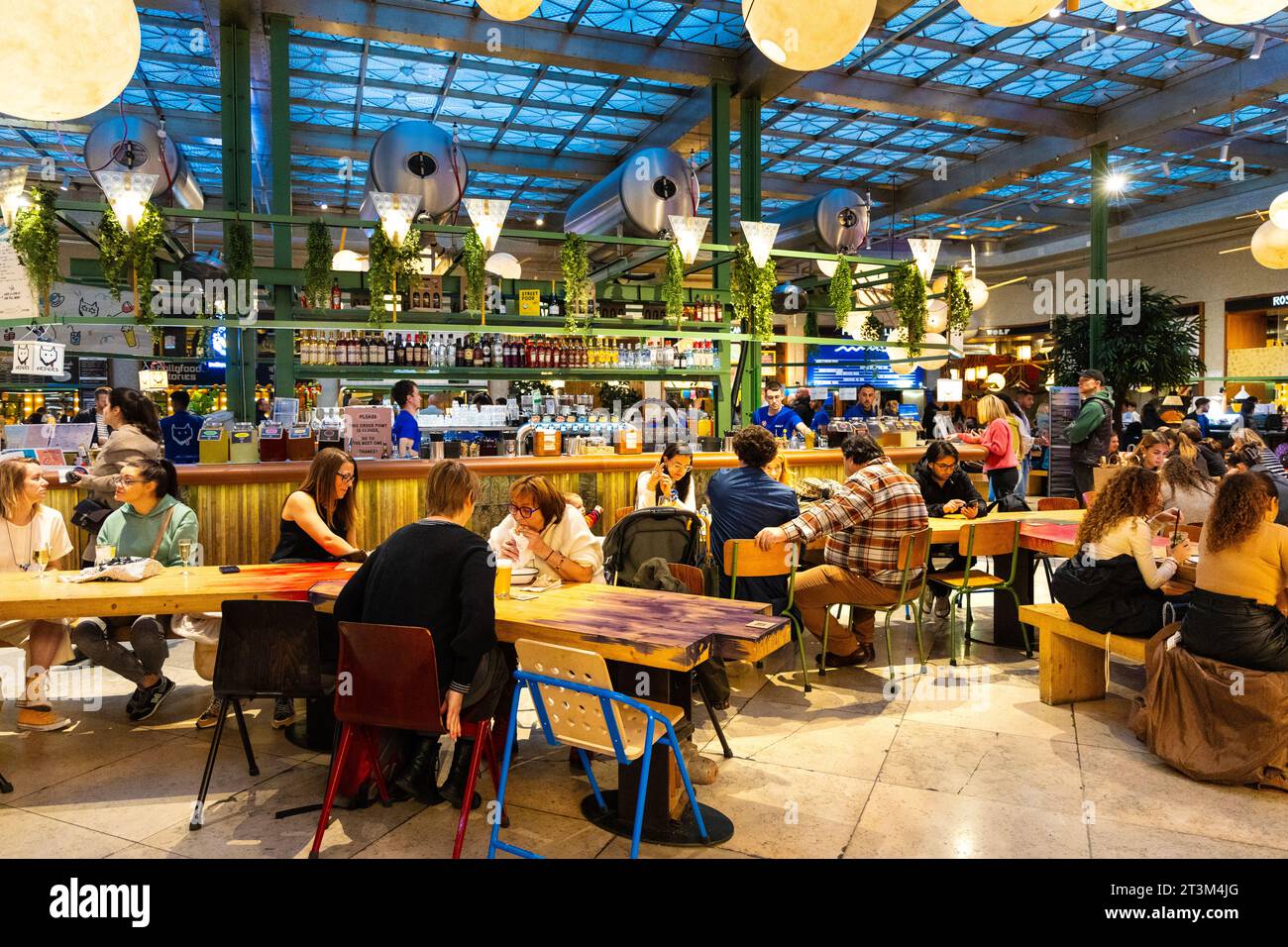 People dining out at Wolf Sharing Food Market, Brussels, Belgium Stock Photo