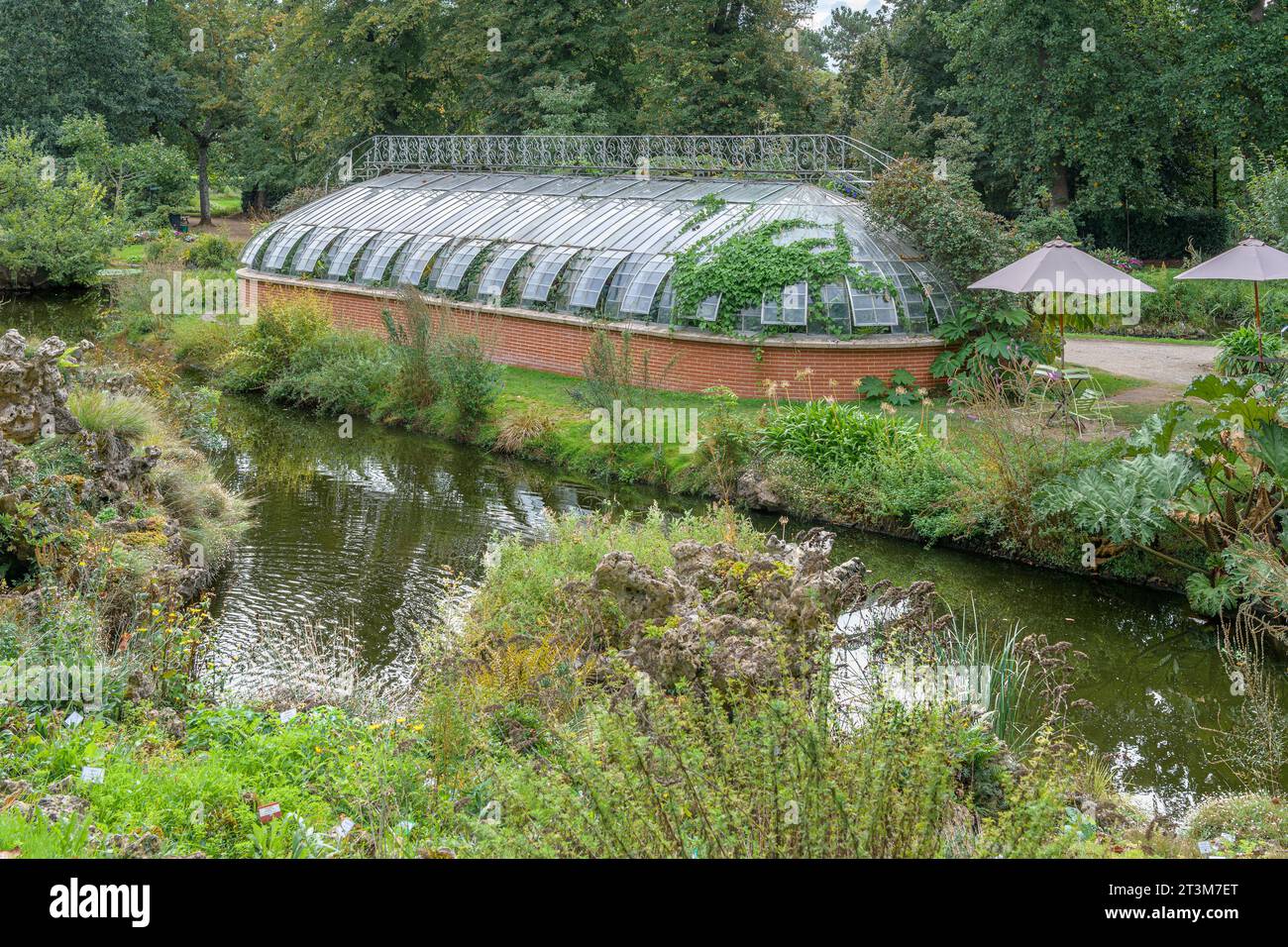 The unusually shaped tropical greenhouse at Nantes Plant Garden (Jardin des Plantes de Nantes). A botanical garden classified as Jardin Remarquable. Stock Photo