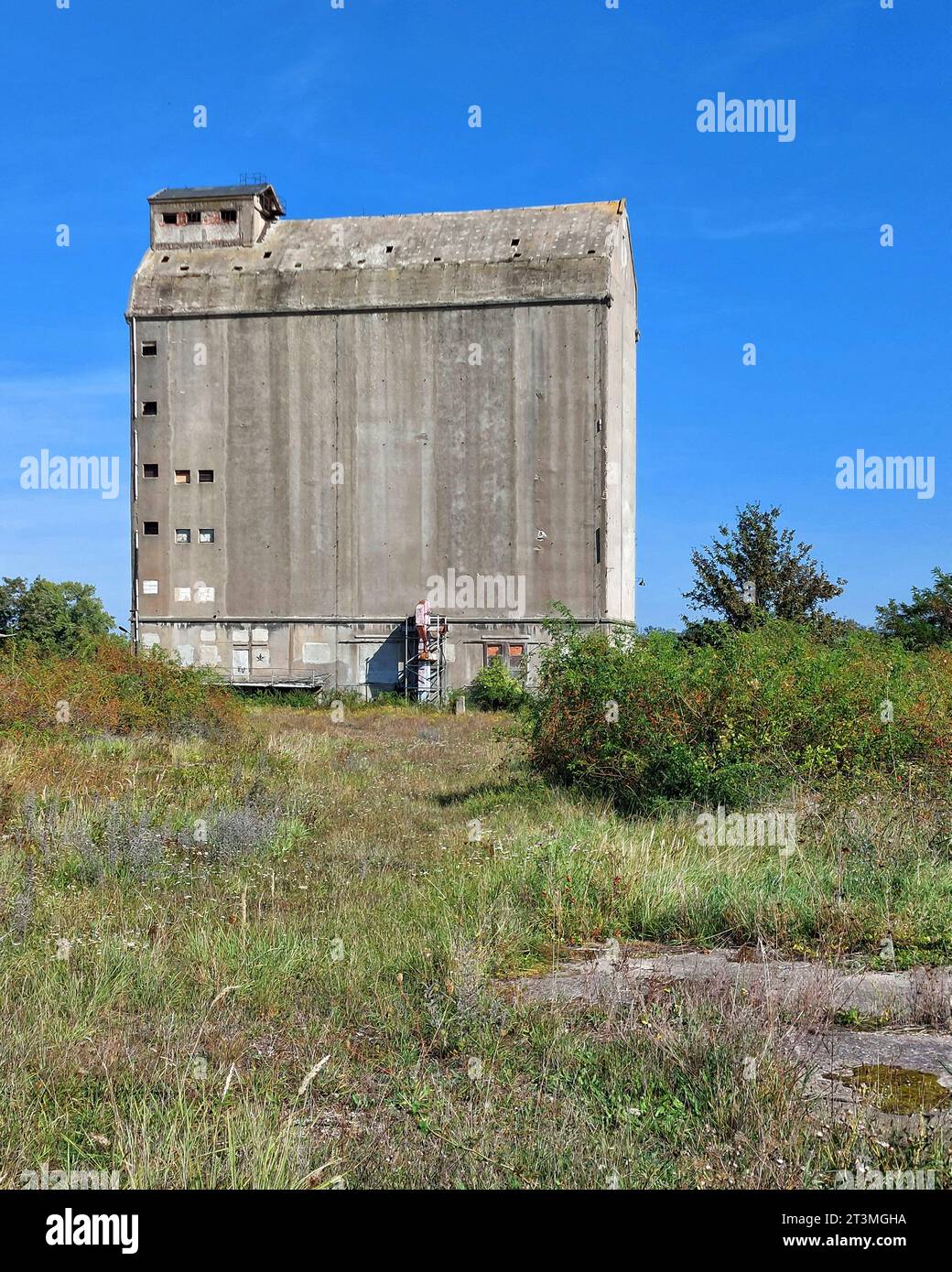 Abandoned concrete silo in Germany on sunny day. Stock Photo