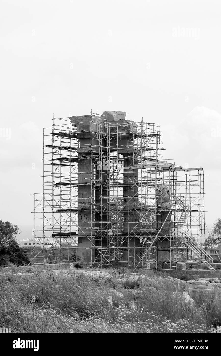 Acropolis of Rhodes, Temple of Pythion Apollo under construction standing on Monte Smith hill in black and white Stock Photo