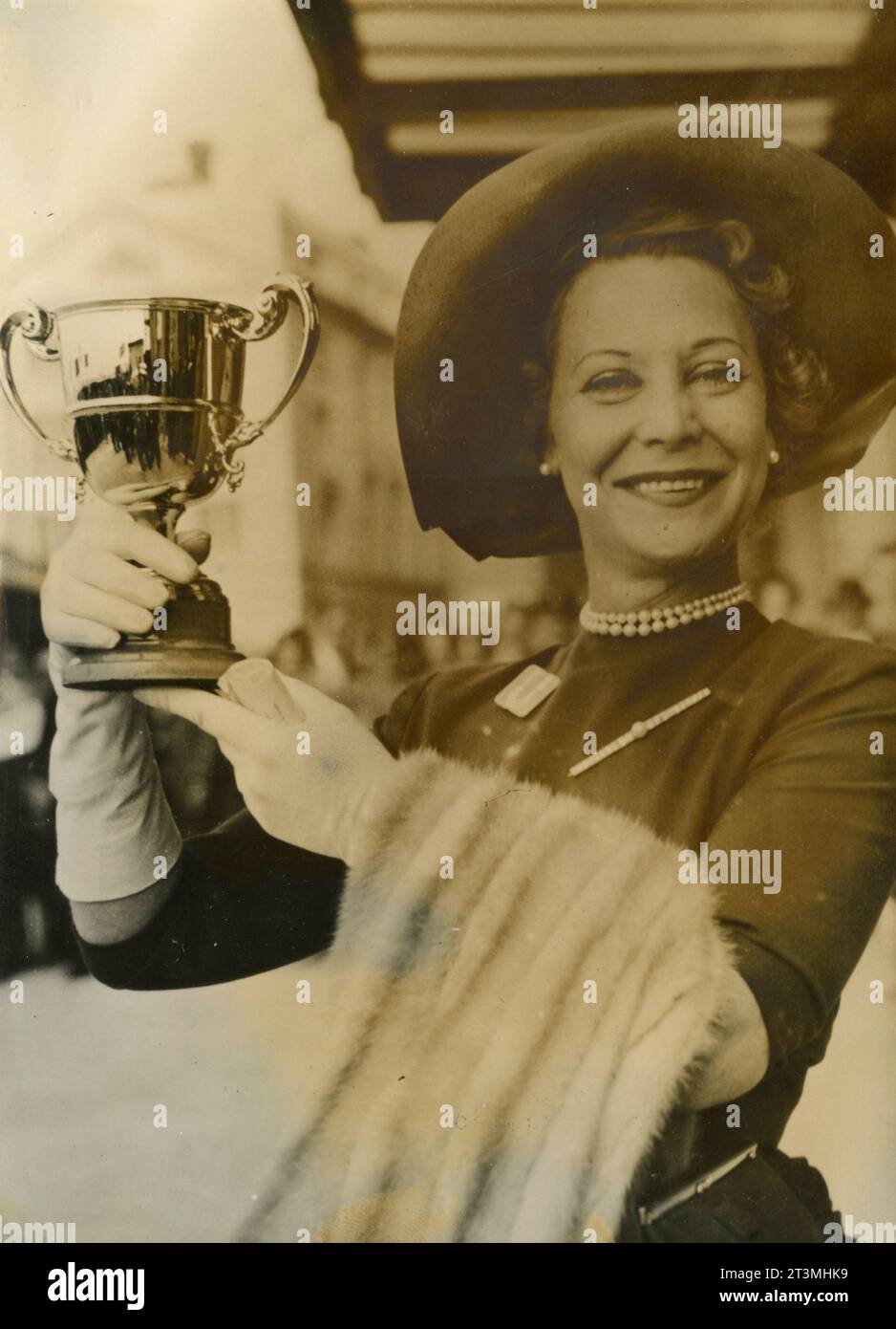 French horse breeder Suzanne Volterra with the Derby d'Epsom prize, France 1955 Stock Photo