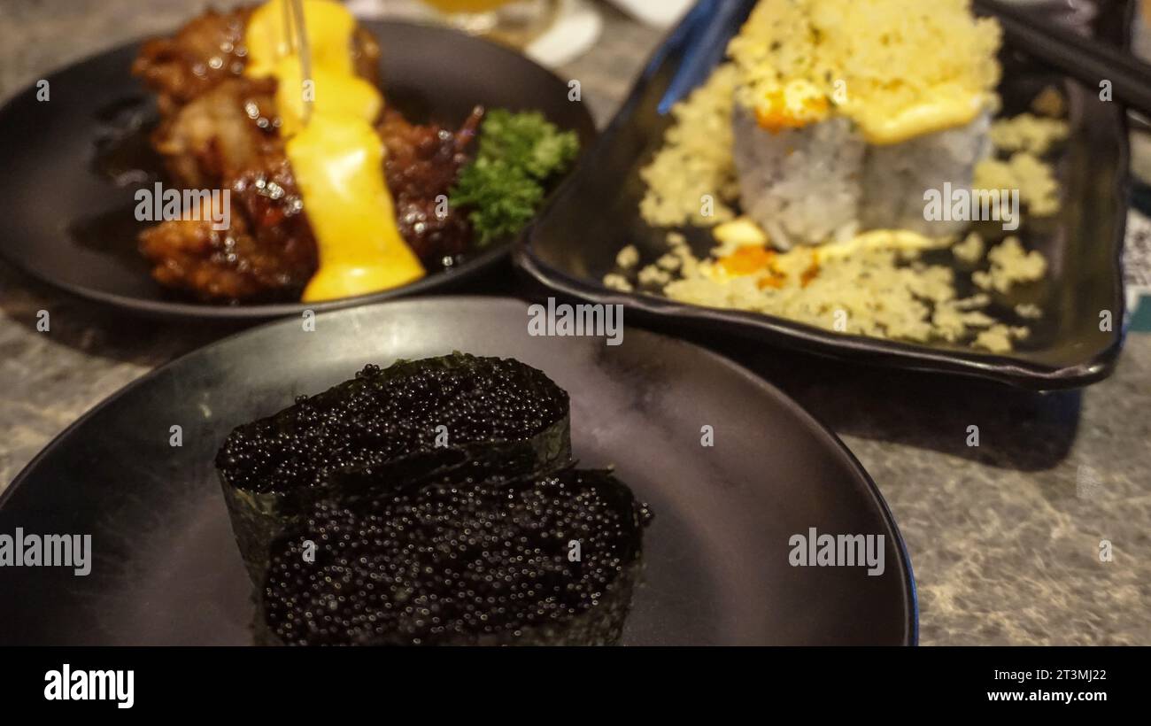 On the menu at a Japanese restaurant, there is caviar sushi, mayonnaise