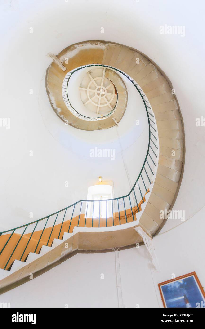 The spiral staircase inside Happisburgh lighthouse, Norfolk, the oldest working light in East Anglia, England Stock Photo