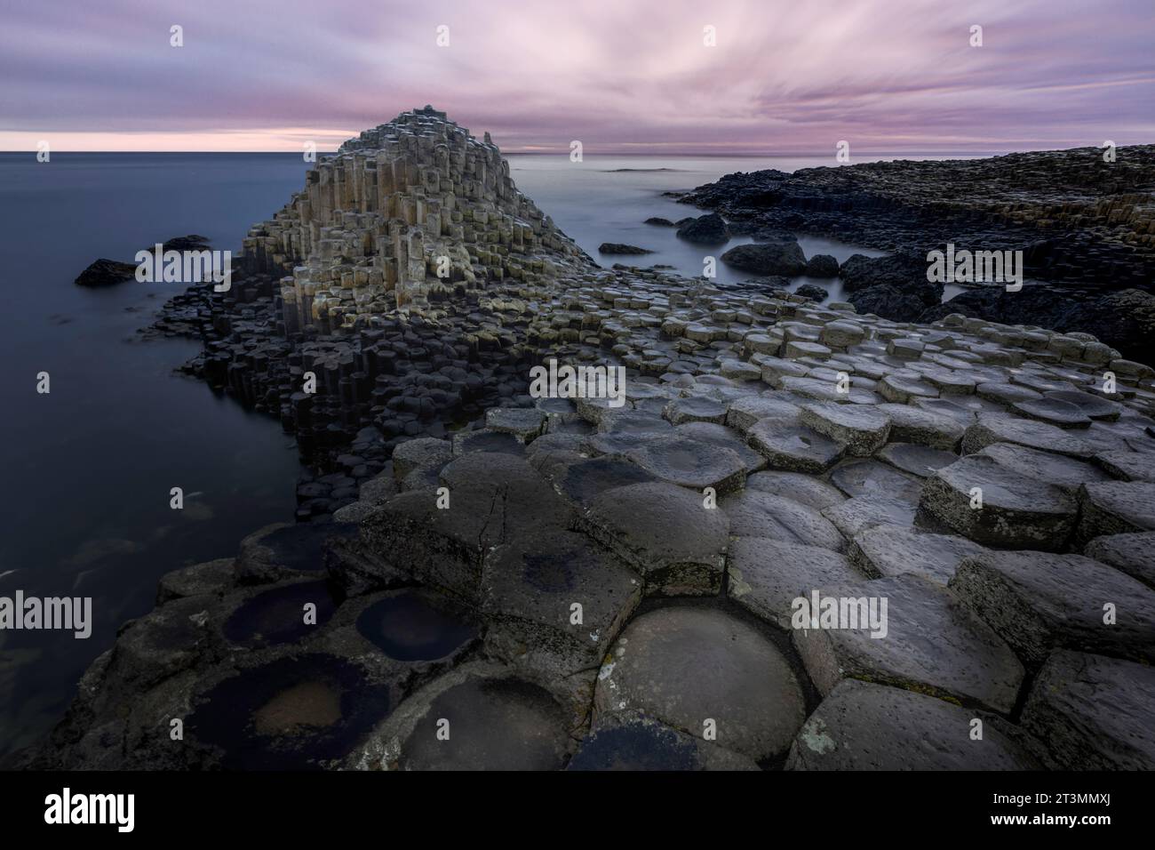 The Giant's Causeway is a UNESCO World Heritage Site located on the coast of Northern Ireland. It is a geological wonder consisting of over 40,000 int Stock Photo