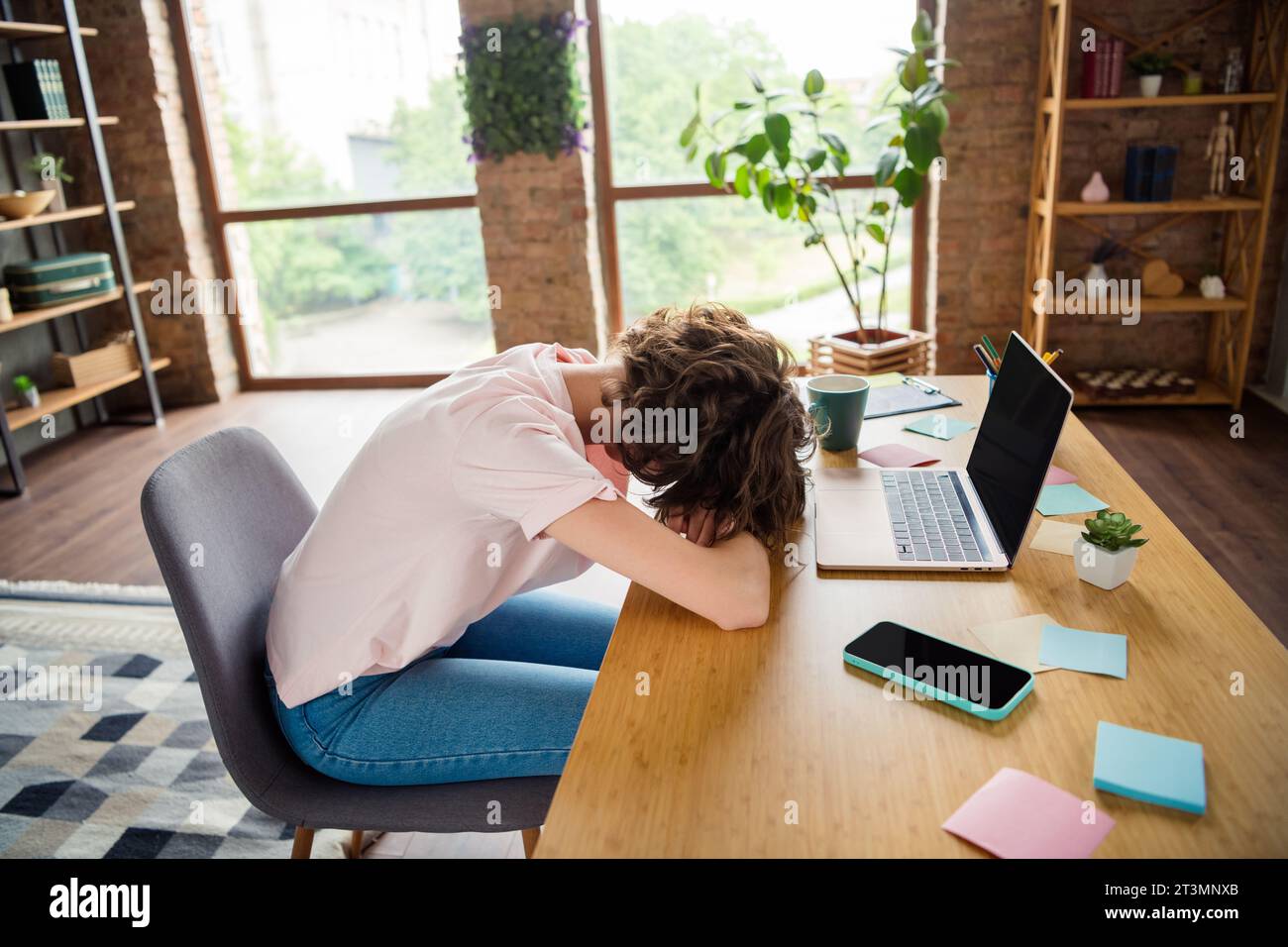 Photo of overworked young businesswoman sleep office hands over wooden ...