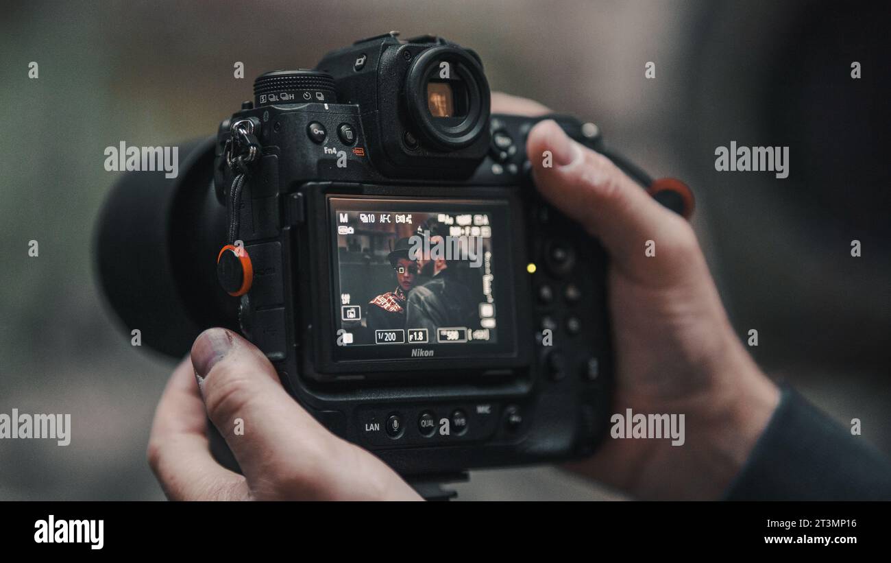 male hands holding camera Stock Photo