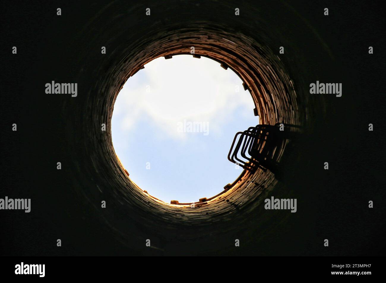Upward view from inside of an old chimney. Stock Photo
