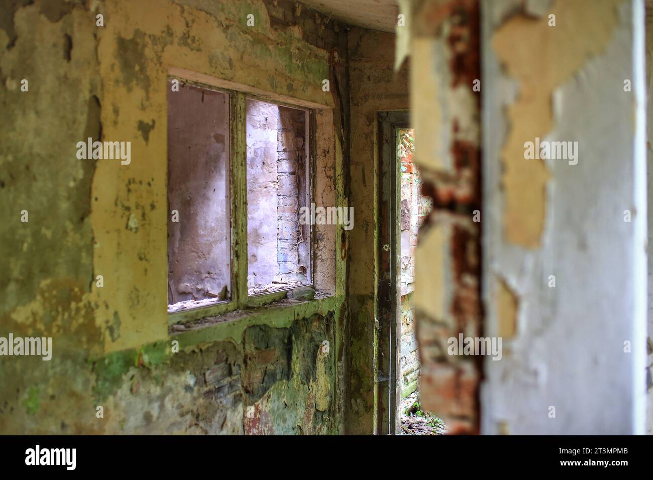 Broken and decayed entrance of an abandoned building. Stock Photo