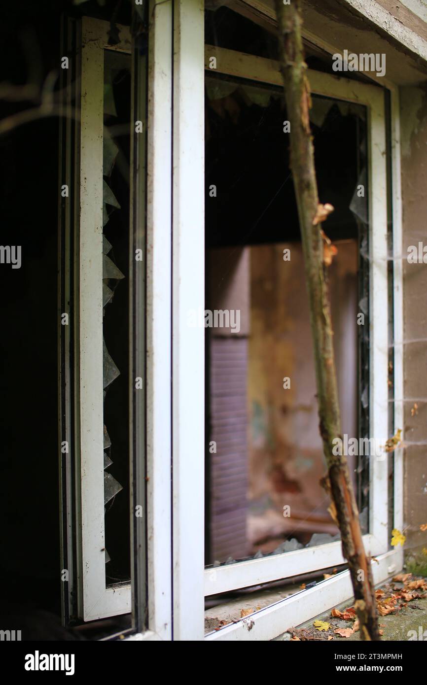 Broken and open window with glass shards. Stock Photo