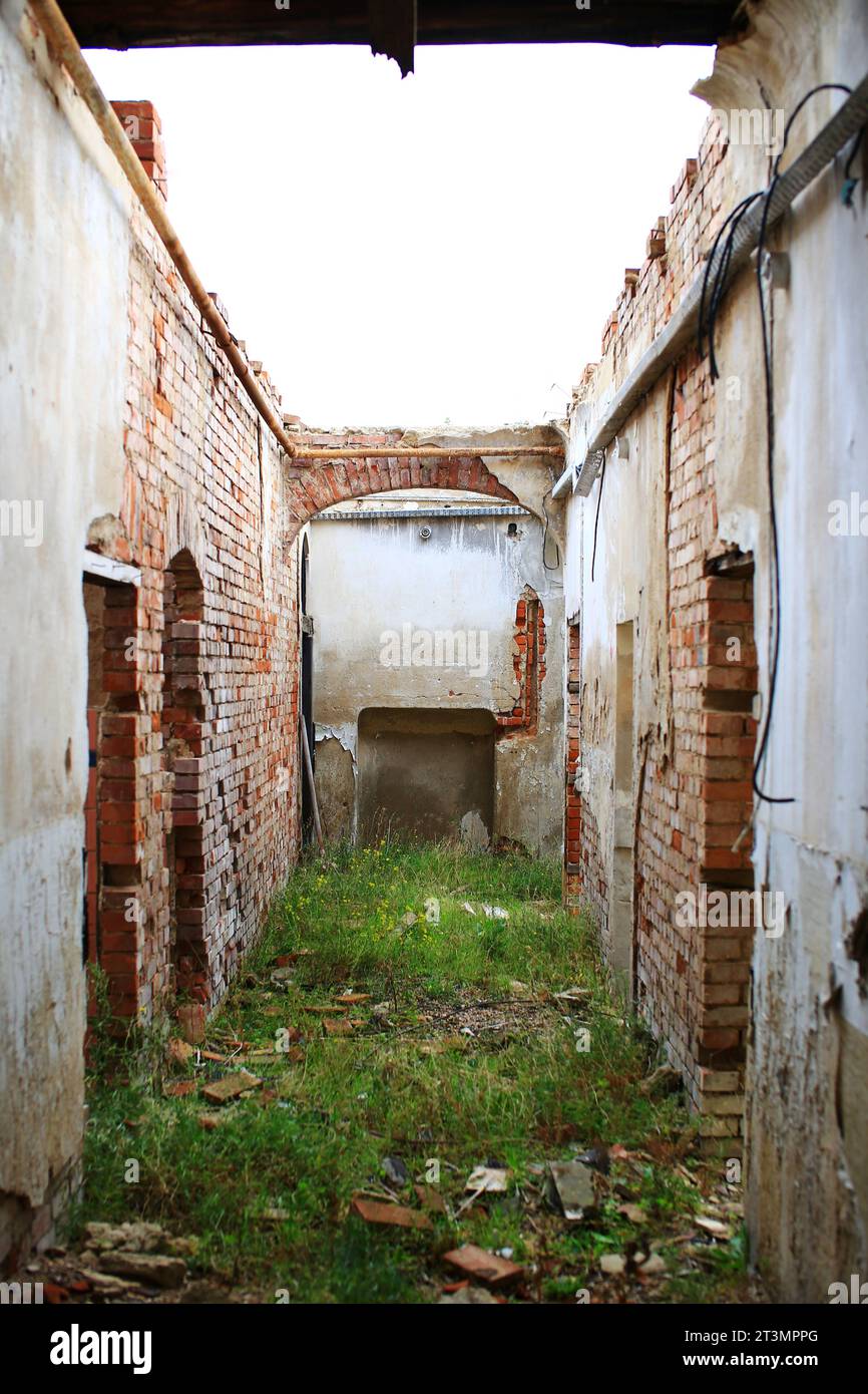 View through corridor of an abandoned building without roof. Stock Photo