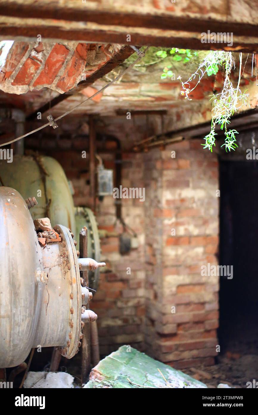 Unused storage tanks in basement of an abandoned building. Stock Photo