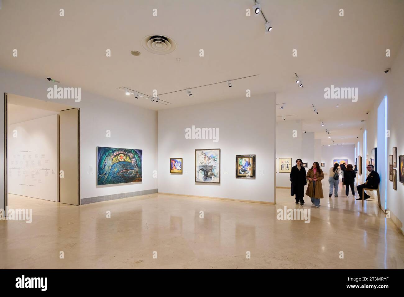 MADRID SPAIN October 26, 2023 Art enthusiasts admiring paintings in the gallery of the