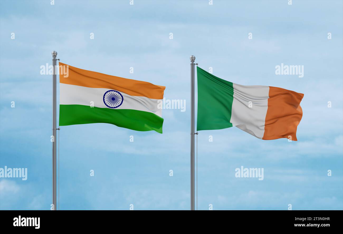 Ireland and India flags waving together in the wind on blue cloudy sky ...