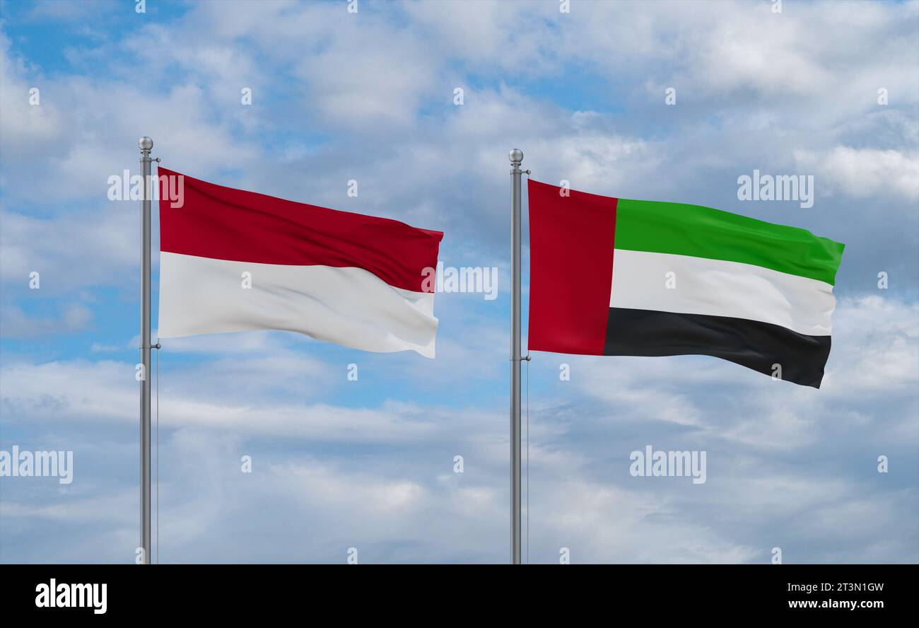 United Arab Emirates and Indonesia and Bali flags waving together in the wind on blue cloudy sky, two country relationship concept Stock Photo