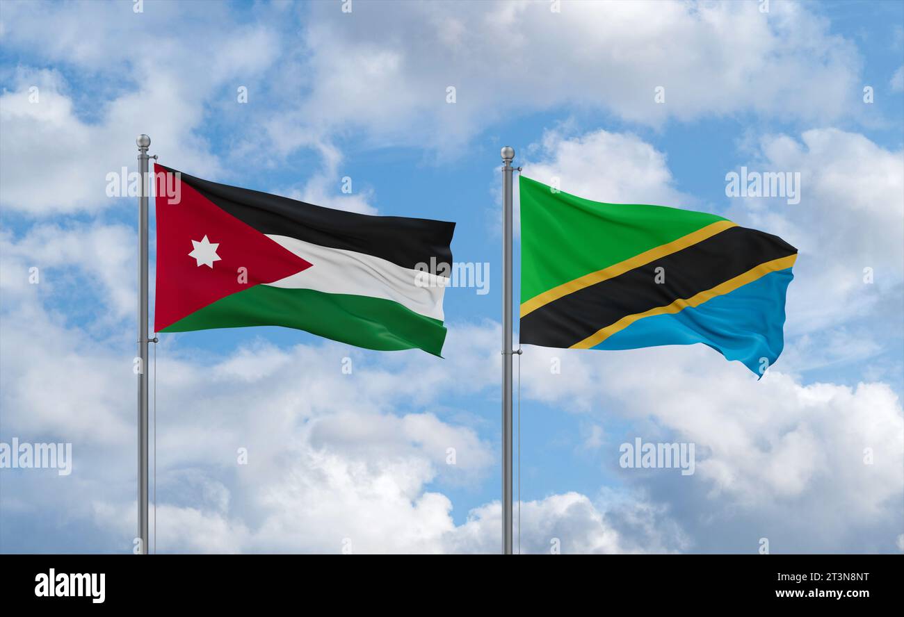 Tanzania and Jordan flags waving together in the wind on blue cloudy ...