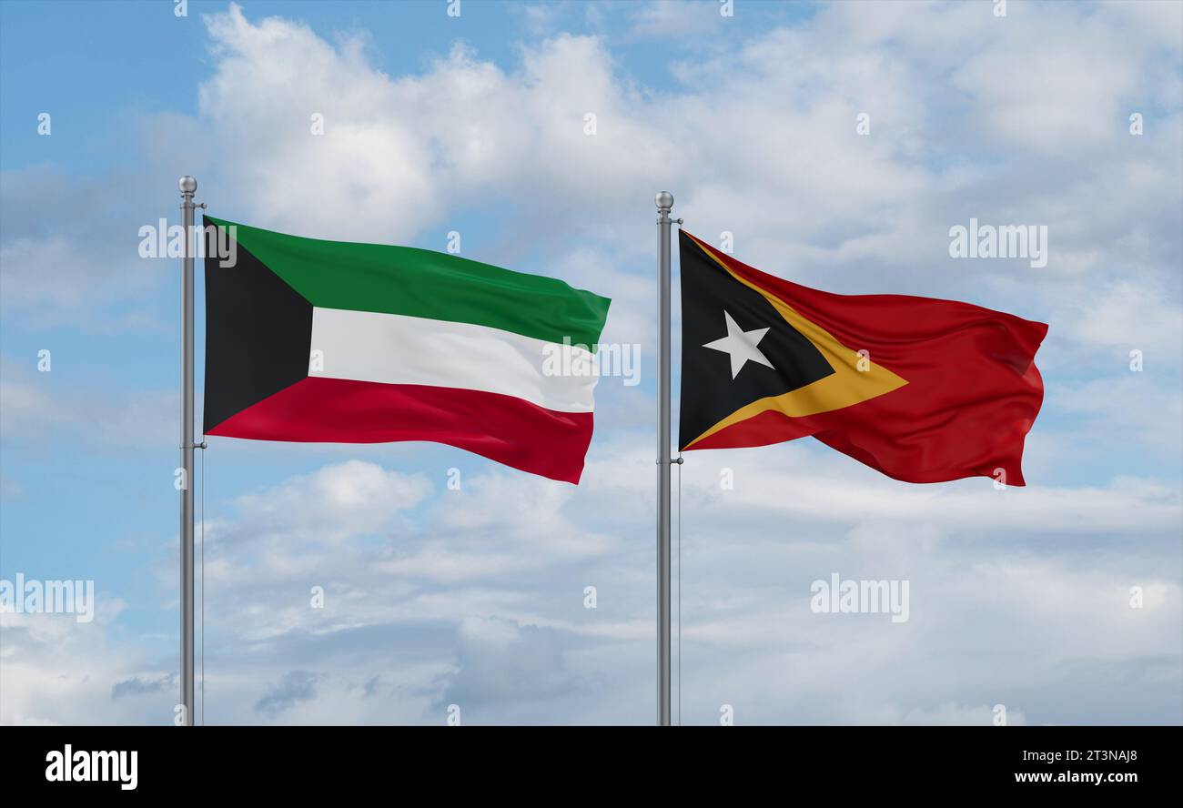 East Timor and Kuwait flags waving together in the wind on blue cloudy ...