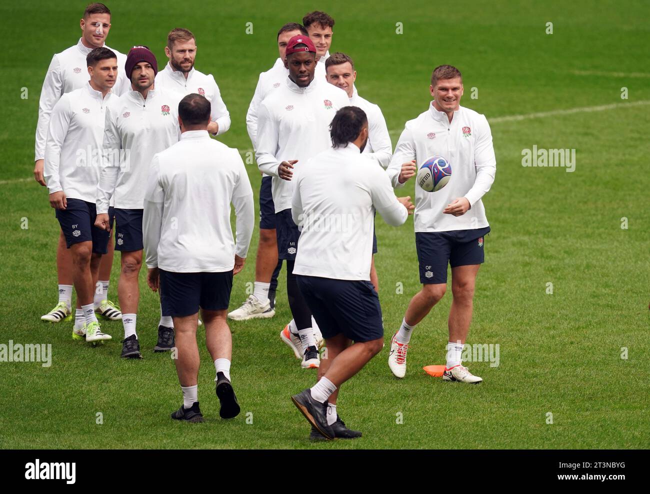 England's Owen Farrell (right) during a team run at the Stade de France ...