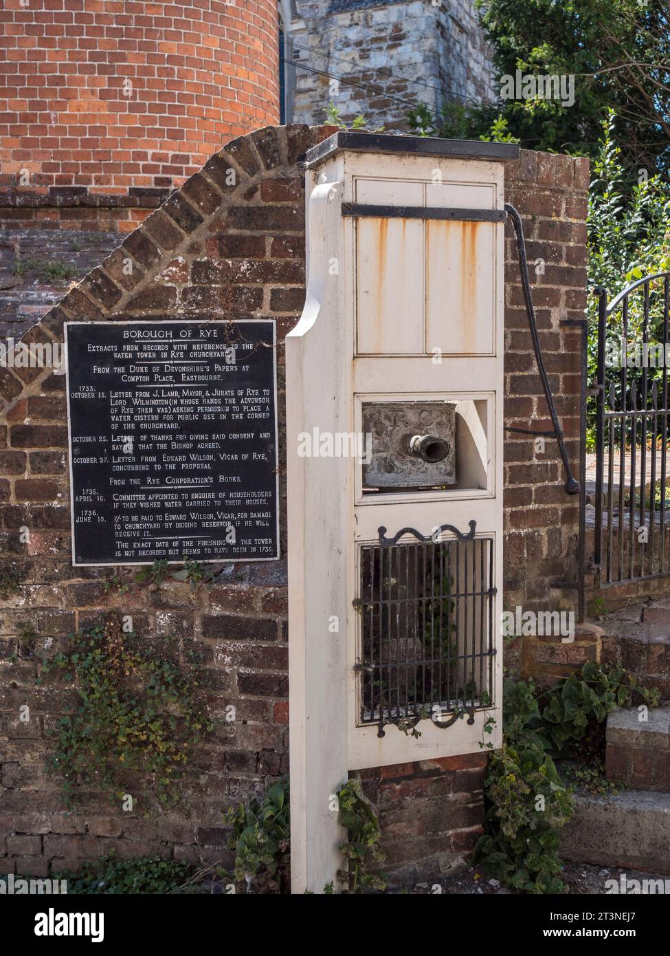 Plaque marking the water tower in the churchyard of the Church of Saint Mary, in Rye, East Sussex, UK. Stock Photo