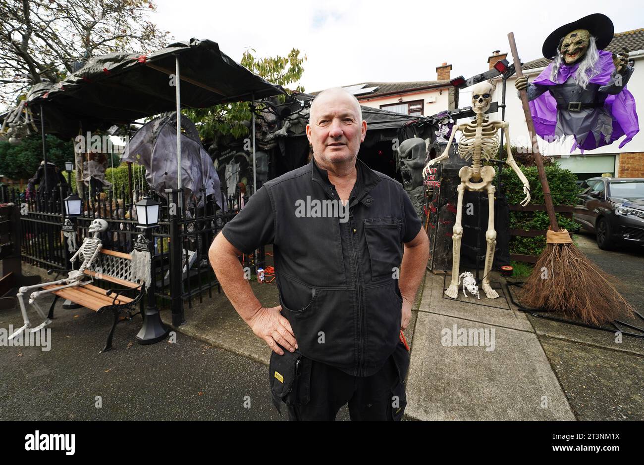Electrician Ken Carraher continues preparations on his Halloween House