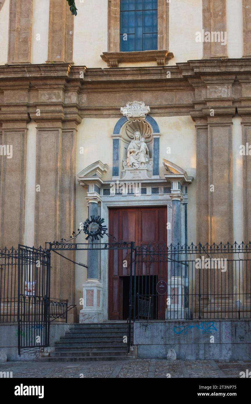 Palermo, Sicily, 2016. The door of the Sicilian baroque Church of the Gesù topped with a statue of the madonna with Child (vertical) Stock Photo