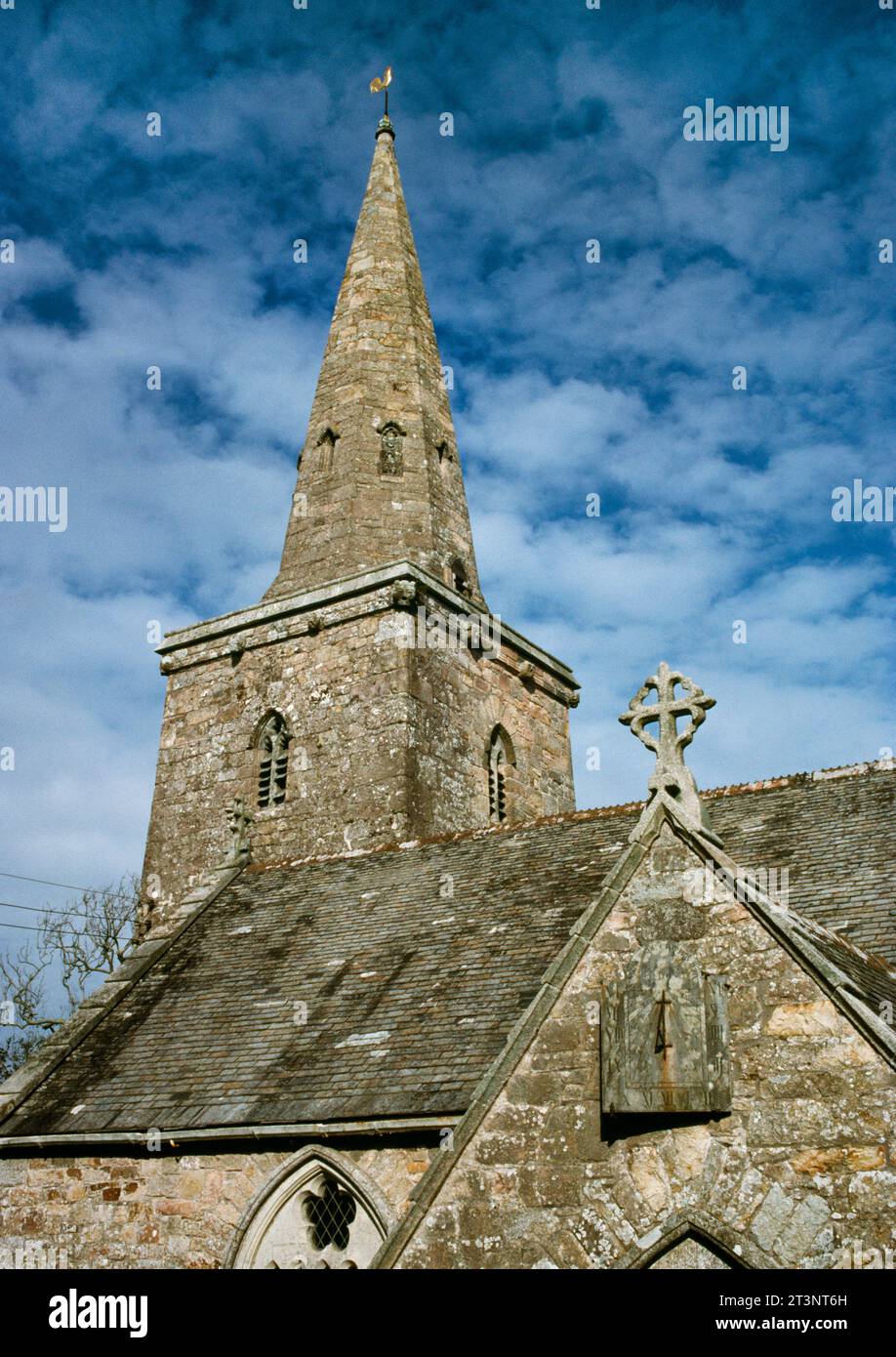 View NNW of the C13th west tower & broach spire of St Hilary's Church