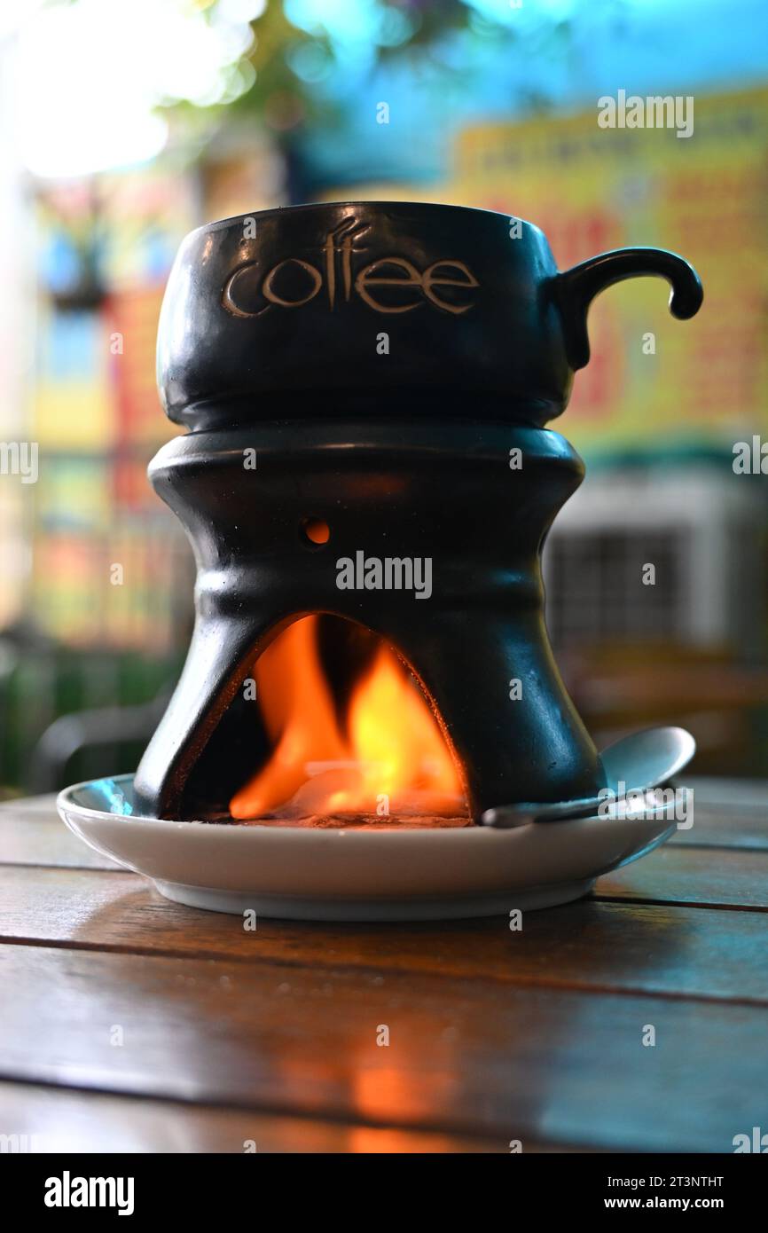 Close up of a cup of hot vietnamese egg coffee prepared with fire Stock Photo