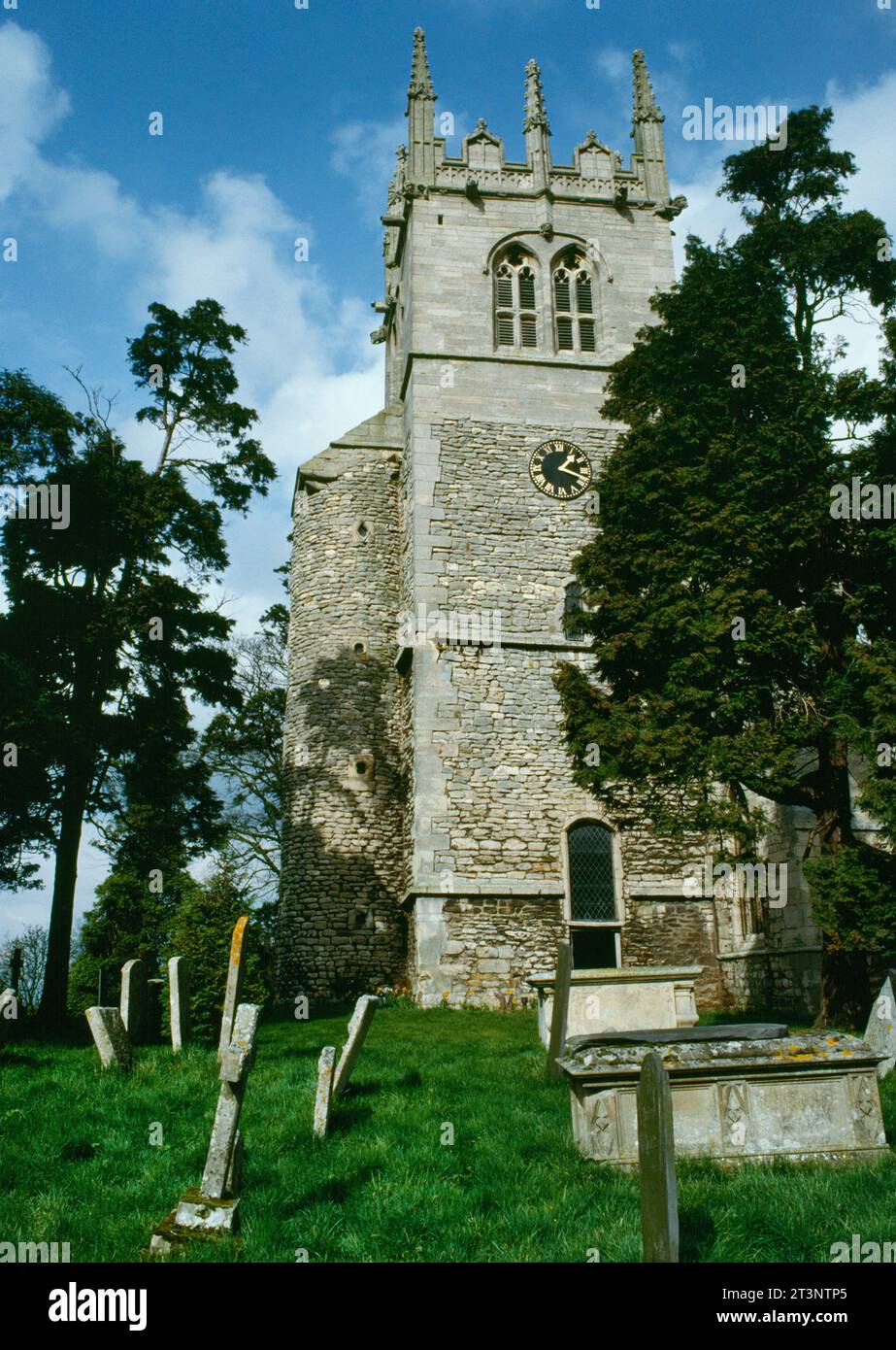View NNE of late C10th Anglo-Saxon square tower & attached circular stair turret at W end of All Saints Church, Hough-on-the-Hill, Lincolnshire, UK. Stock Photo