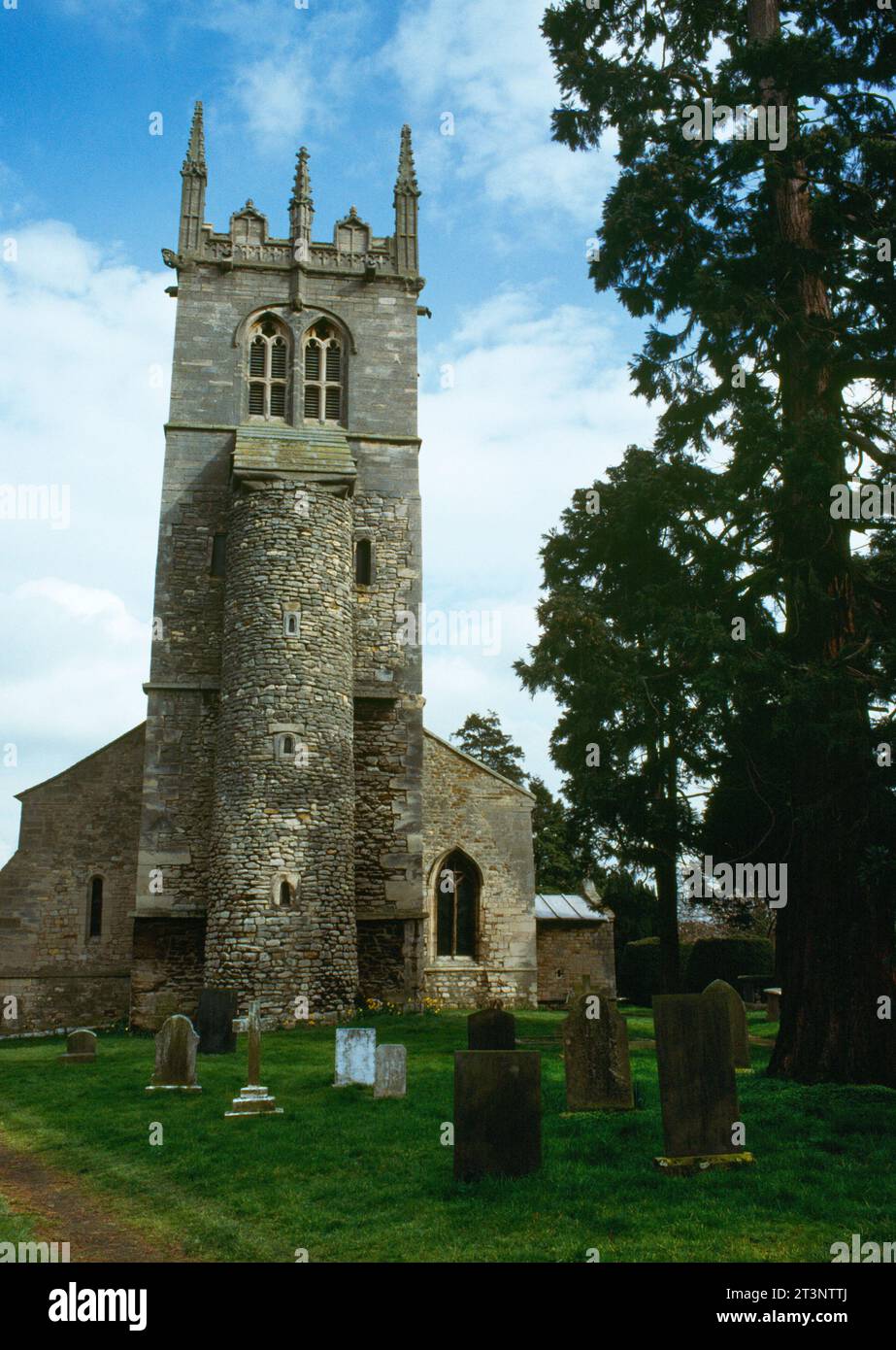View E of the late C10th Anglo-Saxon square tower & attached circular stair turret at W end of All Saints Church, Hough-on-the-Hill, Lincolnshire, UK. Stock Photo