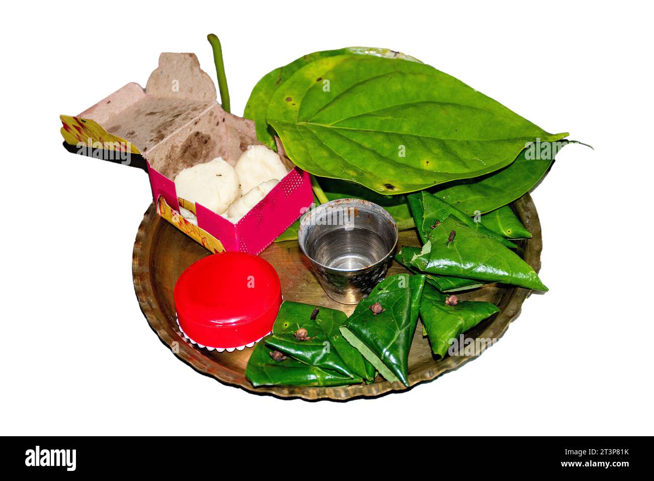 Ingredients of Indian Betel Leaf or paan, a mouth freshener and digestive, include sauf, supari, clove, gulqand, in Betel leaves, often as Puja Thali Stock Photo