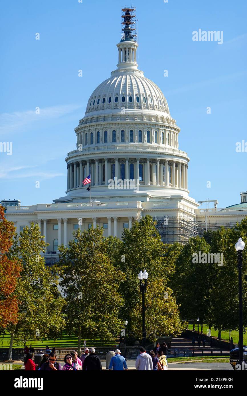 United States Capitol building dome with people and US flag, October 2023 during House Speaker vote, Washington, DC, USA. Stock Photo