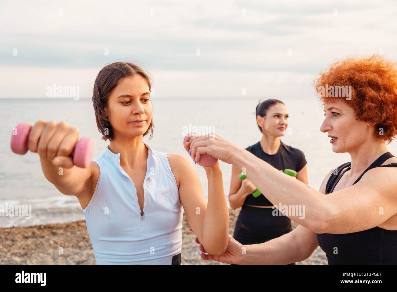 Using Strength Correctly Coach teaches young woman how to do strength exercises correctly ...