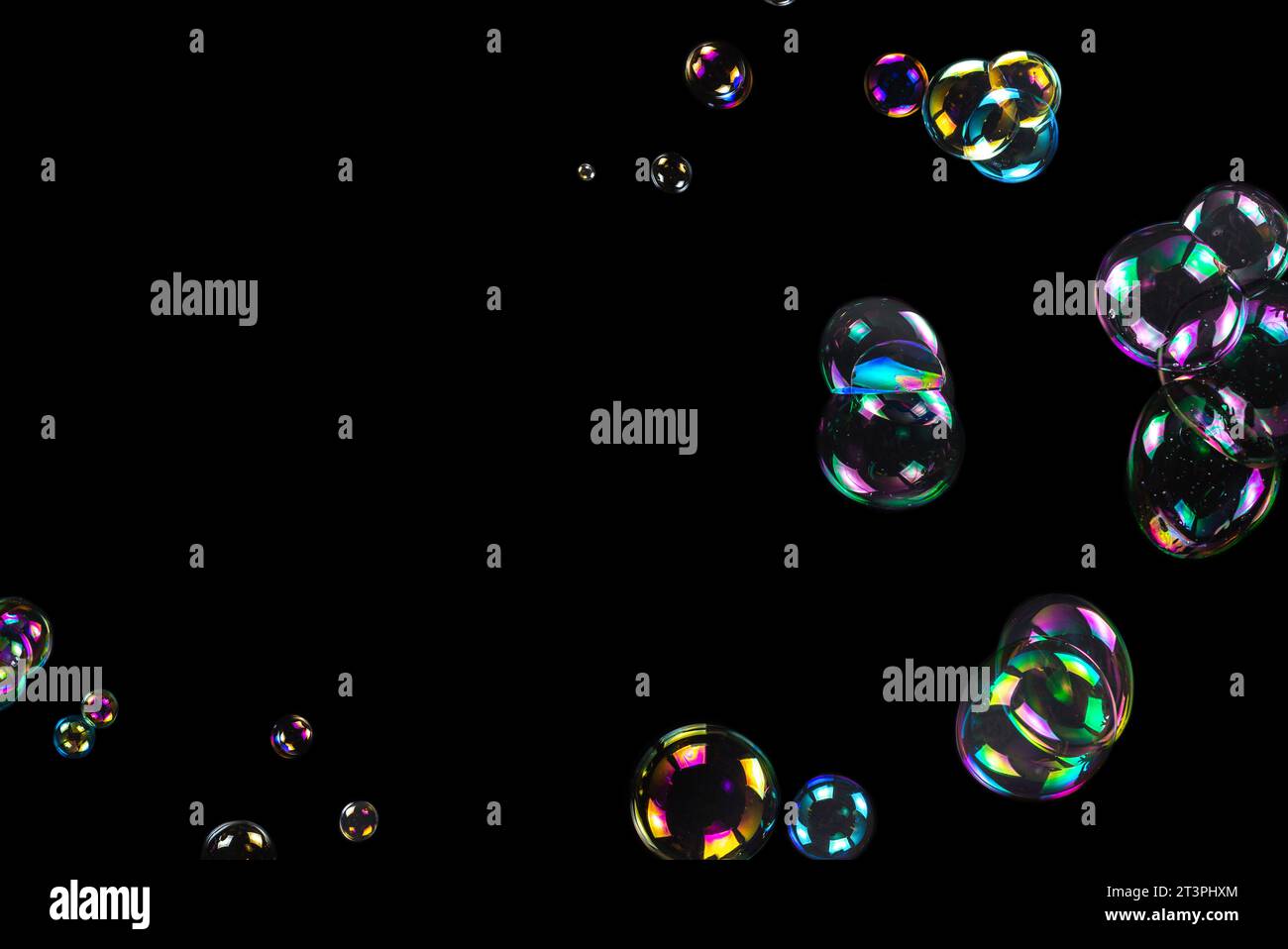 Soap bubbles isolated on a black background. Copy space Stock Photo - Alamy